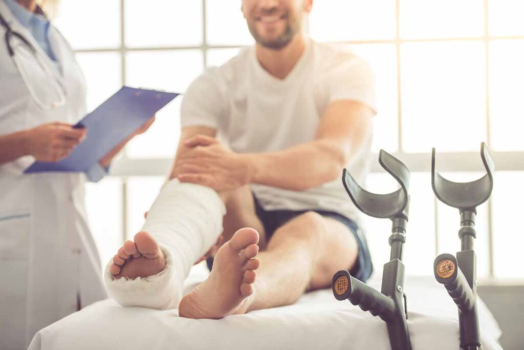 Man in hospital with cast on leg